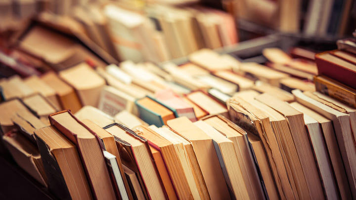 Stacks of library books.