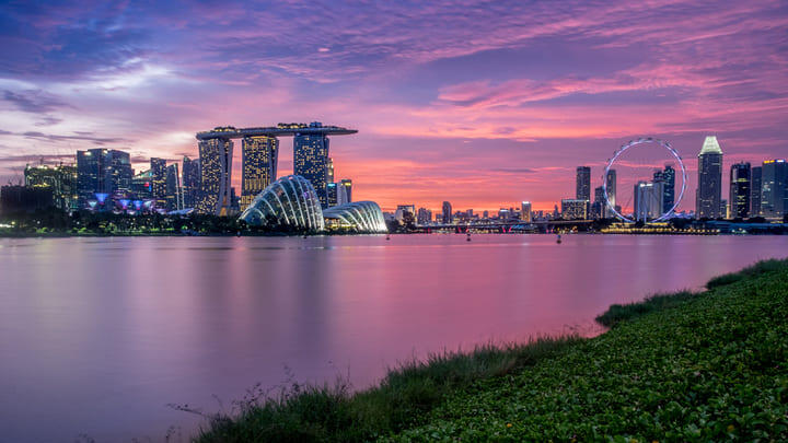 Sunset over Marina Barrage with views of Marina Bay Sands and the Gardens by the Bay