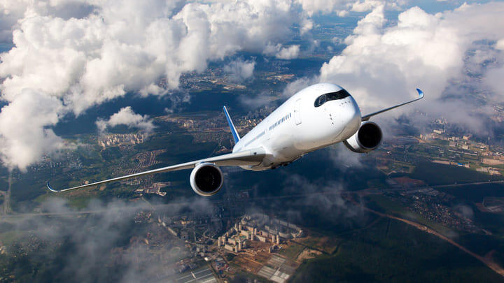 Aeroplane flying upwards through the clouds