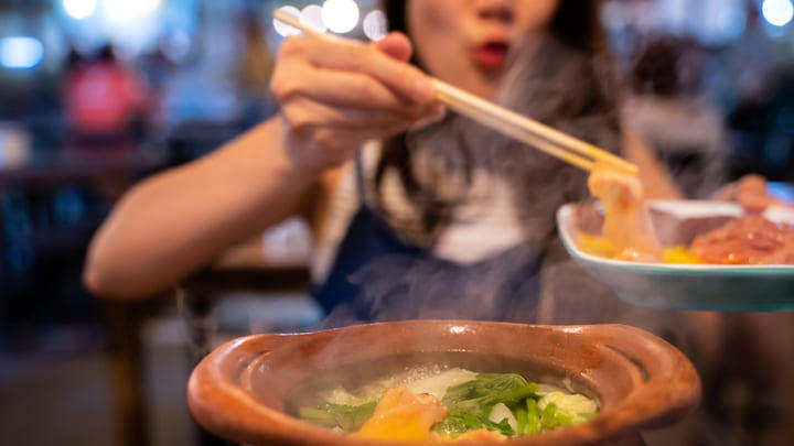 Couple sharing a steamboat dinner in Singapore