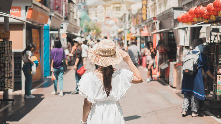 Woman walking through Singapore's Chinatown neighborhood