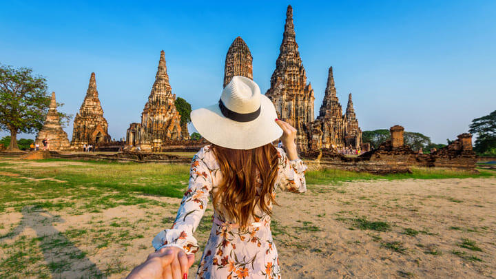 Tourist visiting the ancient city of Ayutthaya in Thailand.