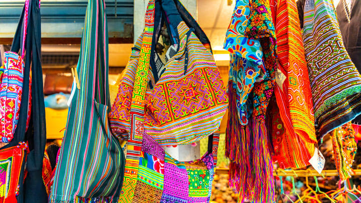 Colorful handmade bags at Chatuchak Weekend Market in Bangkok.