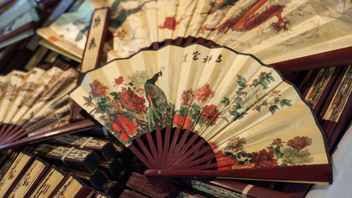 Traditional painted paper fans for sale in Chinatown, Bangkok.