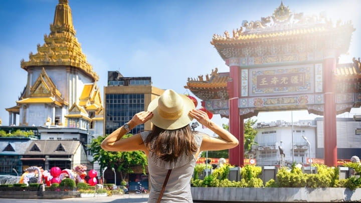 Tourist visiting Chinatown Gate in Bangkok.