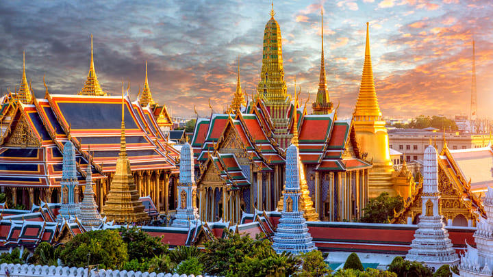 The spires of Bangkok's Grand palace at sunset.