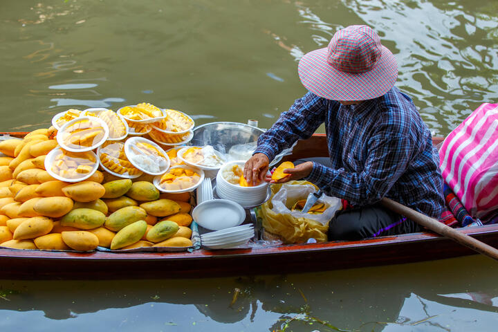 Mango seller at the floating market in Damnoen Saduak.