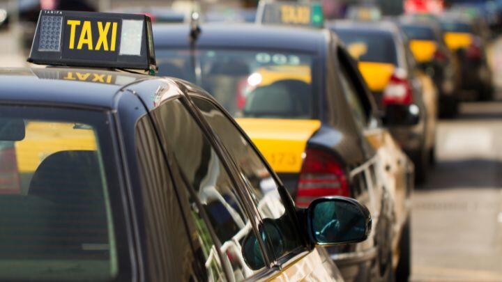 Cropped shot of line of black and yellow taxis in Barcelona