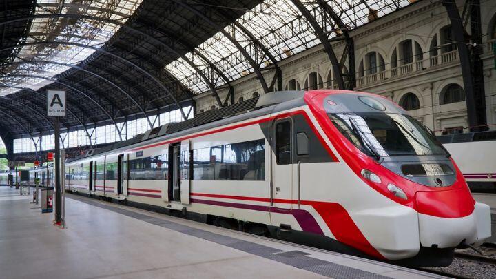 Red & white liveried Renfe train in station, Barcelona