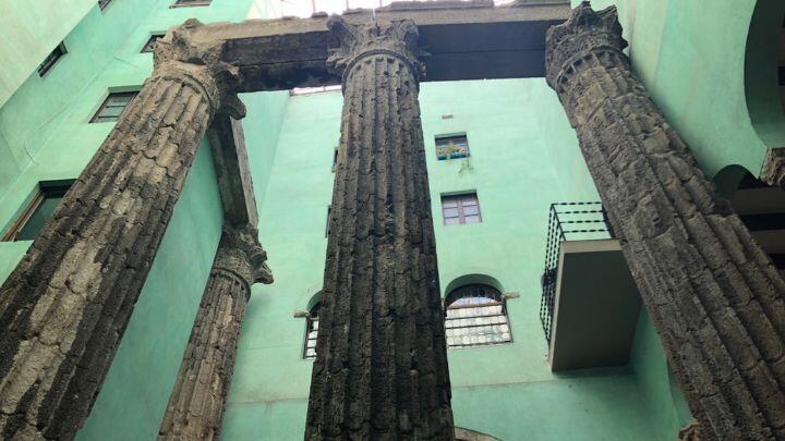 Temple of Augustus, Gothic Quarter, Barcelona, ancient Roman columns against modern green wall