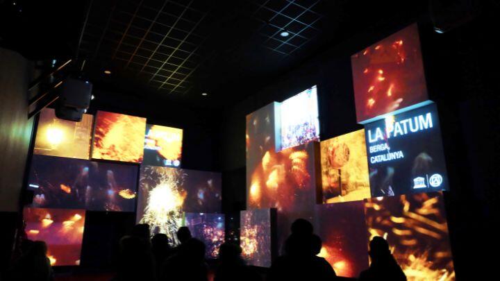 Two walls of light up billboards showing fireworks at Poble Espanyol cultural village Barcelona