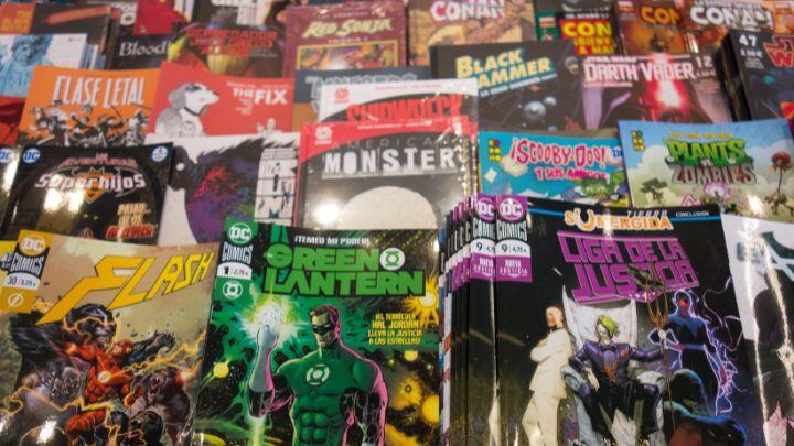 Close up of covers of super hero comics on a book stall
