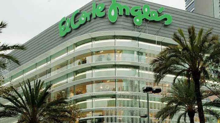 Outside corner view of multi-storey department store El Corte Ingles with green logo