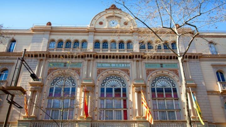 Looking upwards at the majestic frontage of Liceu Opera House, Barcelona