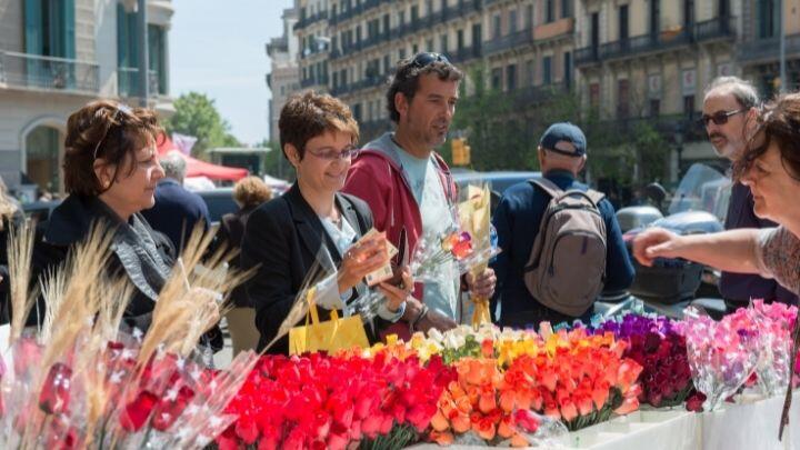 People buying brightly coloured flowers, Rambla de la Flores, Barcelona