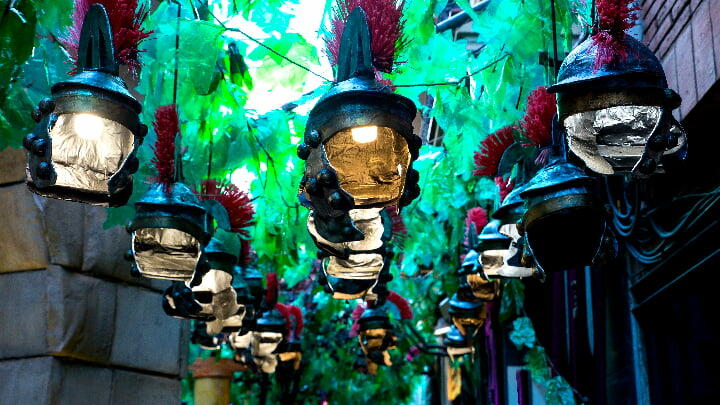 Hanging Roman helmets on display at the Gràcia Festival