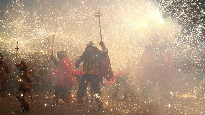 Fire devils parading at the Festa Major de Sants