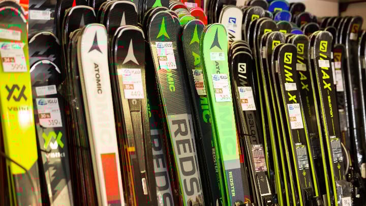 A selection of skis on display in a sports equipment store