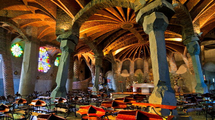 View inside the dimly-lit, ancient-looking grotto of Gaudí's Crypt