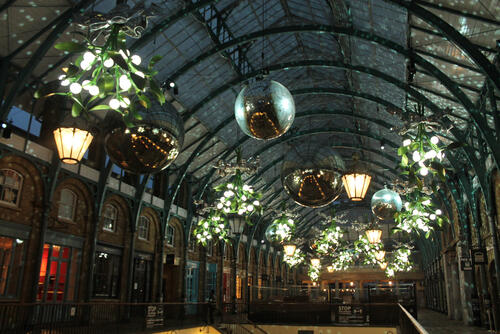 Inside the roof of Covent Garden Market, decorated with giant baubles