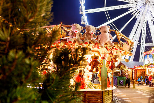 Market stall in Hyde Park Winter Wonderland, with giant wheel in the background