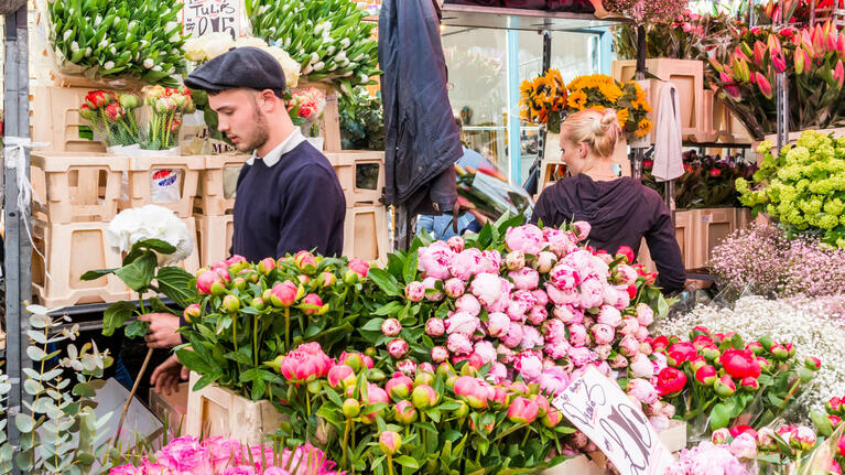 Stallholders prepare the latest blooms at Columbia Road Flower Market