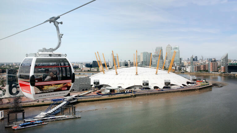 A couple enjoy the views of the Thames from London's cable car