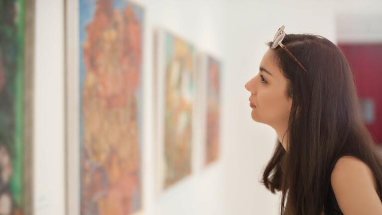 A woman absorbed in a work of art