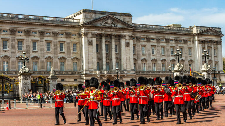 Troops take part in the Changing of the Guard ceremony outside the gates of Buckingham Palace