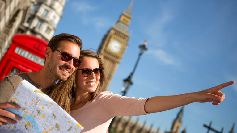 Summer in London is a great time to explore on foot like this couple